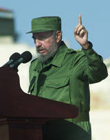 Fidel Castro extolling the virtues of a straight - but artificial - Christmas tree!